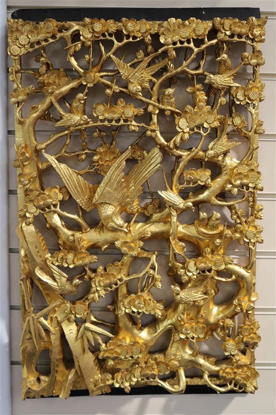 A set of six Chinese carved giltwood panels of birds amid prunus